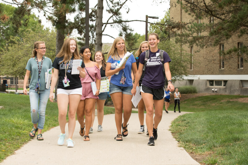  Group of female students walking on side walk