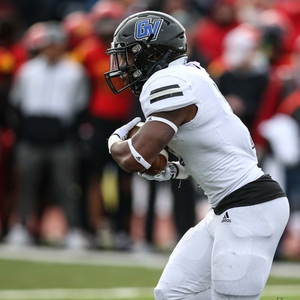 Grand Valley player running with football