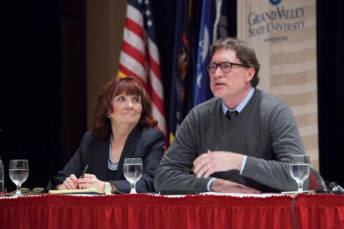Michael DeWilde, right, speaks at a previous Hauenstein Center event.