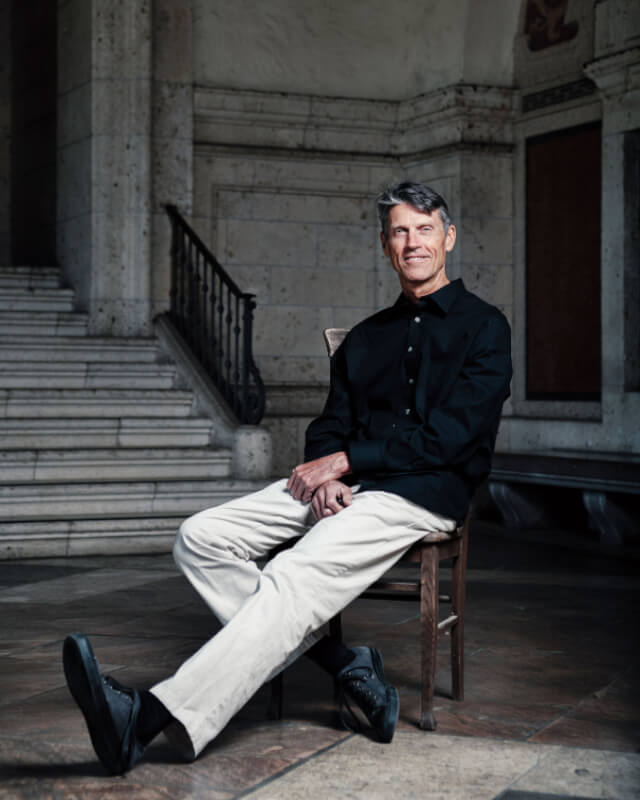 H.W. Brands sits in a chair