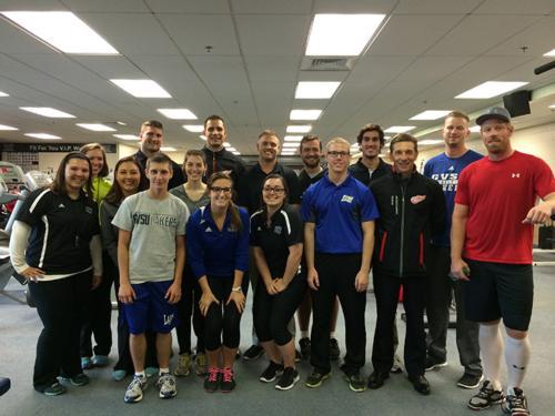 Ross Sherman, back row center, and exercise science students are pictured at the Detroit Red Wings training camp in Traverse City. Red Wing Johan Franzen is in the front row, far right.