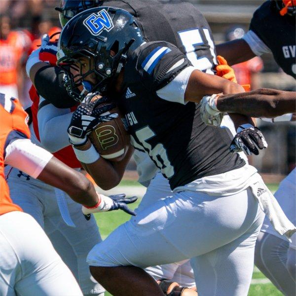 A Grand Valley football player breaks a tackle.