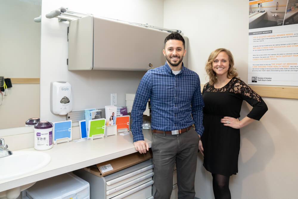 man, woman standing in nurse station