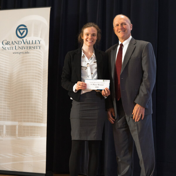 Sarah Lamar, pictured with Jeff Potteiger, dean of The Graduate School, won first place for her research, "Biological Invasions on a Large Scale: Investigating the Spread of Baby's Breath (Gypsophila paniculata) Across North America."