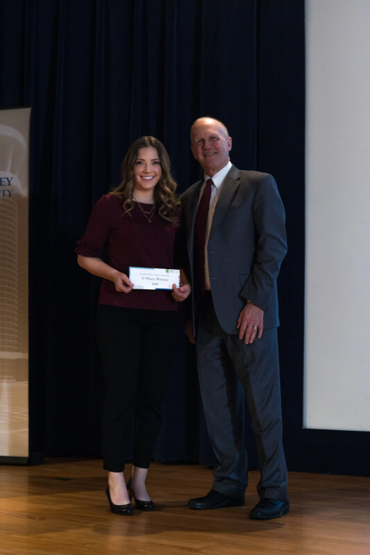 Anne Gembrowski, pictured of Jeff Potteiger, dean of The Graduate School, won third place for her research, "Increasing Prevention and Recognition of Delirium in a Non-ICU Acute Care Population."