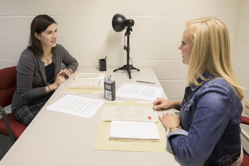 Hosts Leigh Rupinski and Jacklyn Rander provide historical context behind the letters read by Grand Valley students.