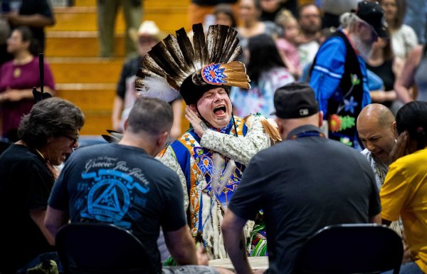 A drum circle sings a song for a dance during the Pow wow.