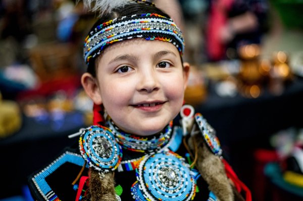 Anna Dashner, 8, poses for a portrait before dancing at the Pow wow. Dasher, of Detroit, has been dancing since the age of 18 months.
