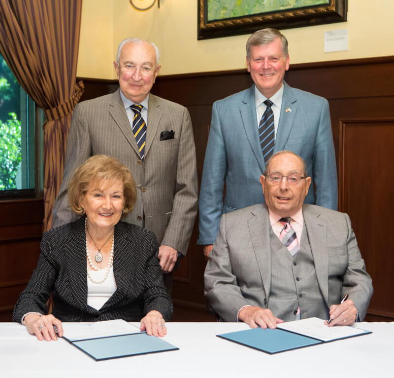 Pictured are back row, from left, Luis Tomatis, director of medical affairs for RDV Corporation, and President Thomas J. Haas; seated are Helen and Richard DeVos.
