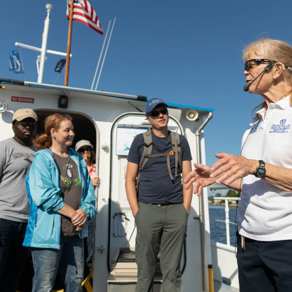 Pictured is Diane Veneklasen, science instructor at AWRI, with students in a geology class aboard a research vessel in Lake Michigan. 