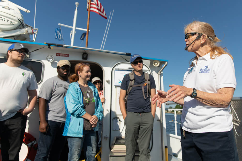 Pictured is Diane Veneklasen, science instructor at AWRI, with students in a geology class aboard a research vessel in Lake Michigan. 