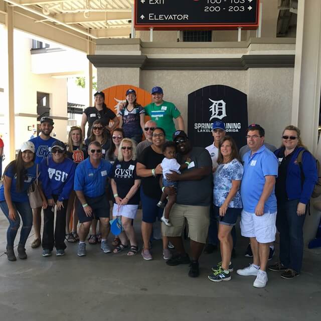 group of people in front of Tigers baseball stadium in Lakeland, Florida.