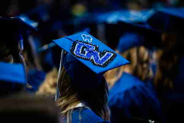 graduation cap decorated with the GV logo.