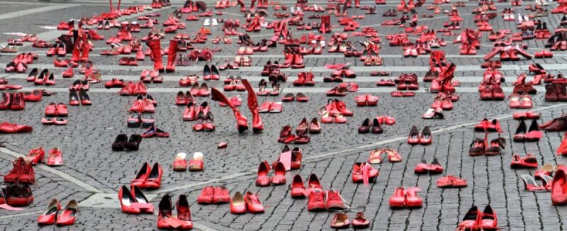 pairs of red shoes on ground