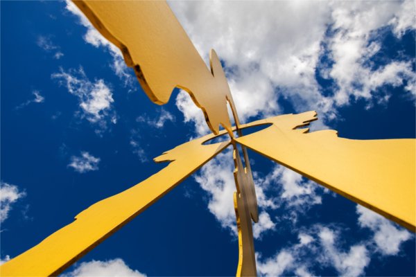 A close-up view from underneath the yellow statue outside of Mackinac Hall Building.