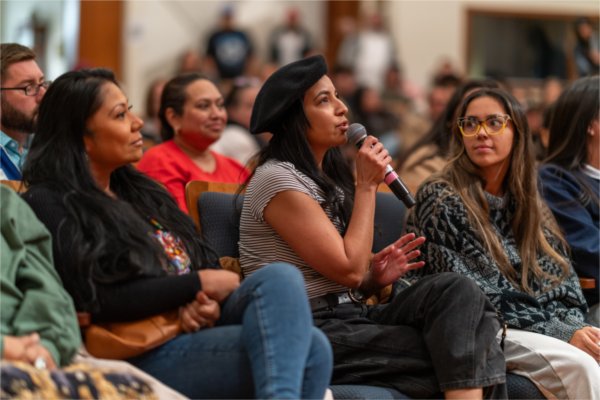 An audience member asks a question to Treuer. 