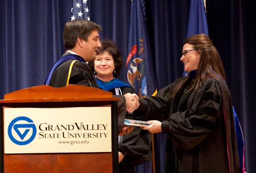 In this 2012 photo, Robert Smart presents a CSCE award to Christine Smith, professor of psychology. The 2013 faculty convocation will be held February 7 in the DeVos Center.