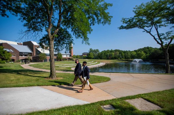 Kyle Boone, GVSU's new director of housing, goes on a tour of the Allendale Campus with Andy Beachnau.