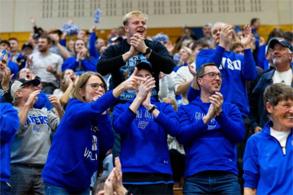 Lakers fans celebrate in the stands during the NCAA Division II Midwest Regional Championship.