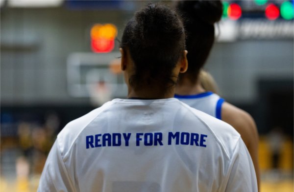 Redshirt freshman Tayla Dillard wears the team's warm-up shirts, reading 'Ready For More.'