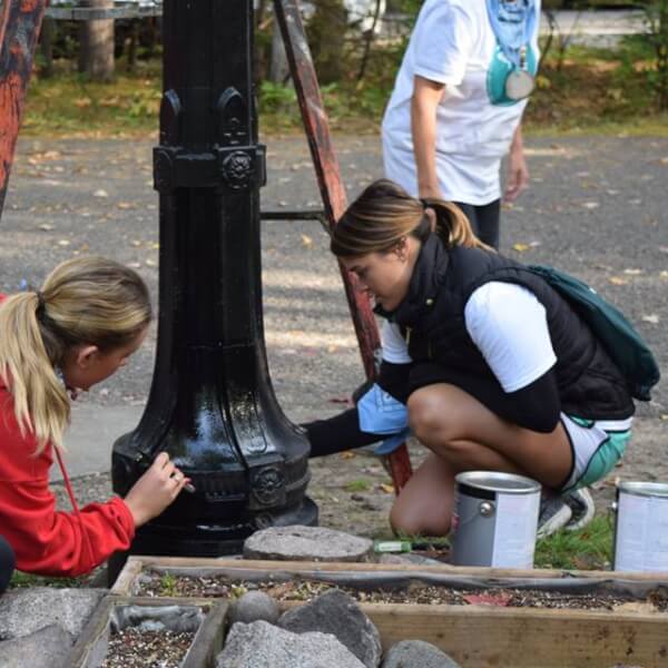 More than 170 students, faculty and tourism industry professionals helped restore the Ralph A. MacMullan Conference Center and the Civilian Conservation Corps Museum.