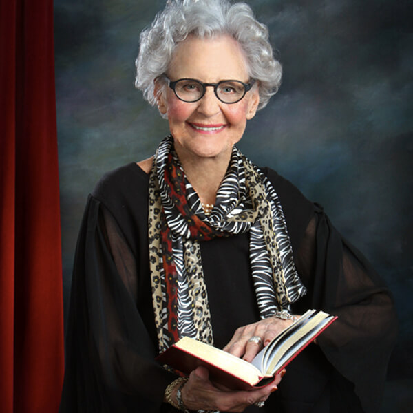 photo of woman holding a book