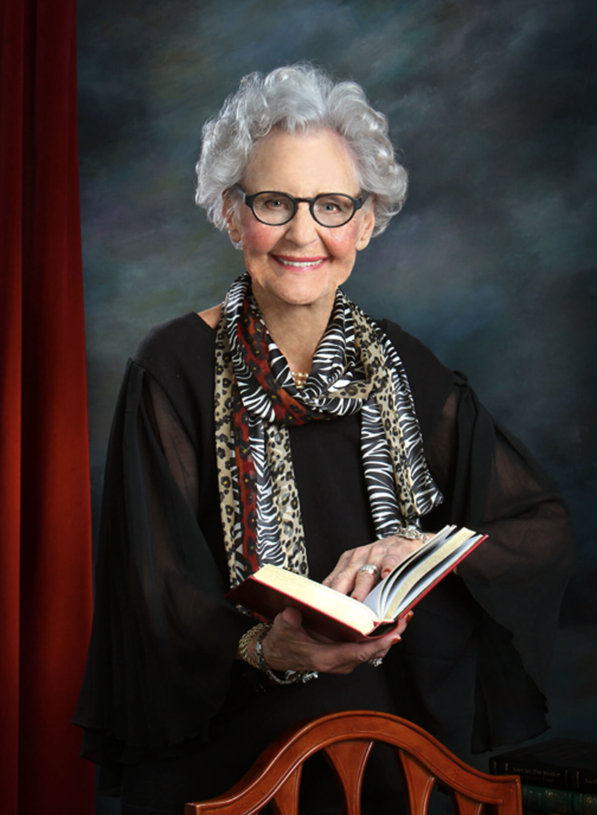 photo of woman holding a book
