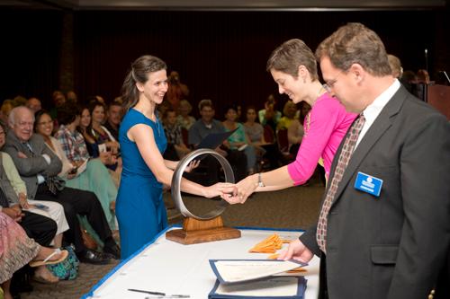 A student receives her iron ring at the Order of the Engineer ceremony.