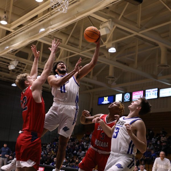 Grand Valley basketball player attempts to score.