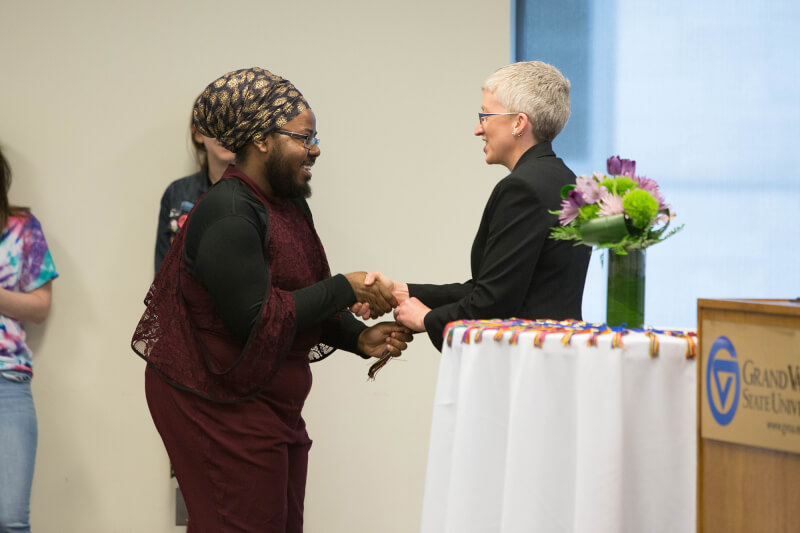 presenting tassel to graduate