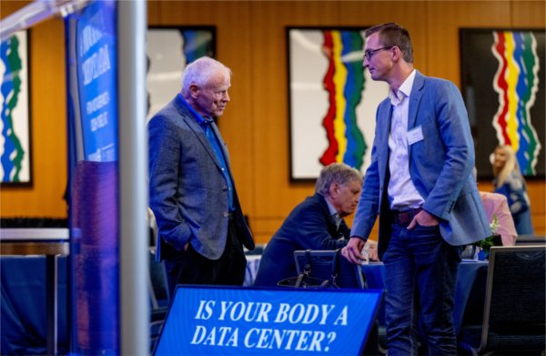 Zach DeBruine, assistant professor in the College of Computing, right, talks with Leroy Hood, left. Hood spoke during &#8220;Is Your Body a Data Center: The Future of Human Health&#8221; as part of Tech Week. 