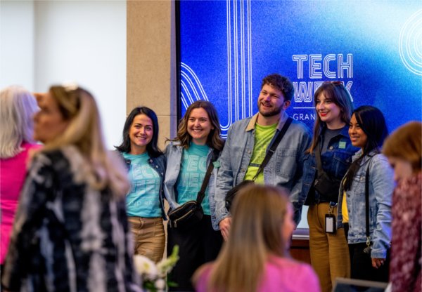 A group that attended Leroy Hood&#8217;s talk pose for a photo. Hood is the scientist who helped pave the way for the Human Genome Project.