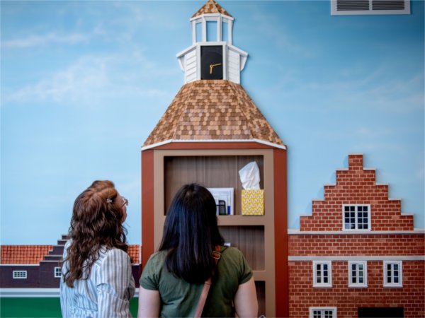 Guests at Little Red Dentistry observe the artwork of Paul Yu, Lara Hinze and Rylan Bernhardt