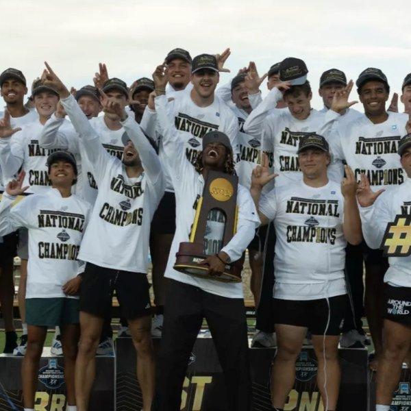 The Grand Valley men's track and field team celebrate its national championship on the podium.