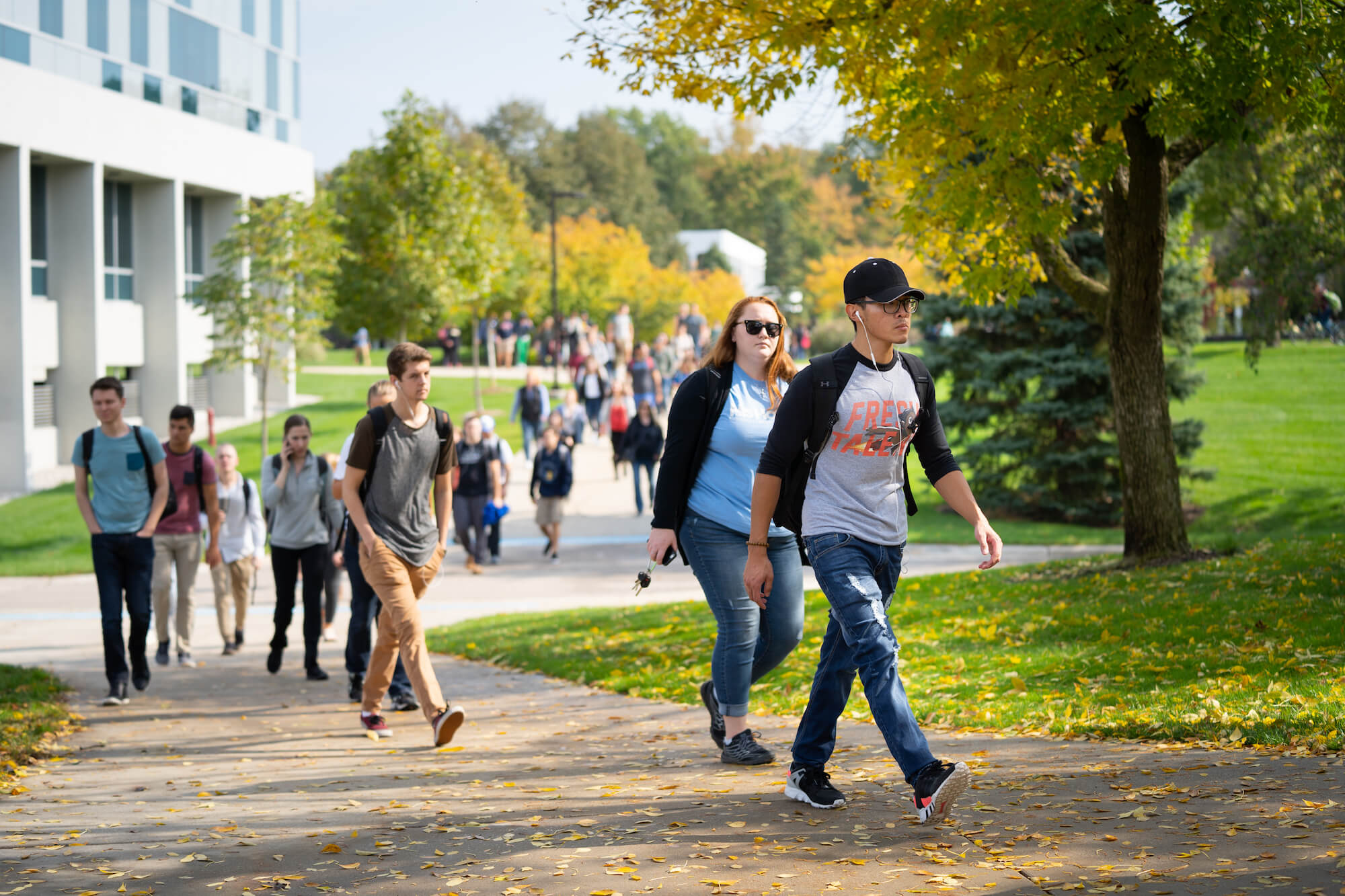 A photo of students walking on the Allendale Campus during fall.