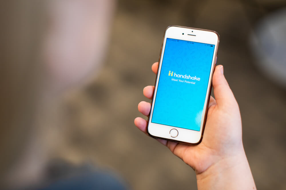 A photo of an iPhone with the Handshake portal open.