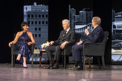 President Mantella sits on a stage with former Presidents Bill Clinton and George W. Bush.
