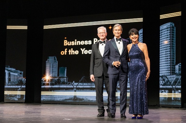 GVSU President Philomena V. Mantella joins Hank Meijer, left, to celebrate Mark Bissell receiving the 2026 Business Person of the Year Award during the Economic Club's 50th Anniversary celebration.