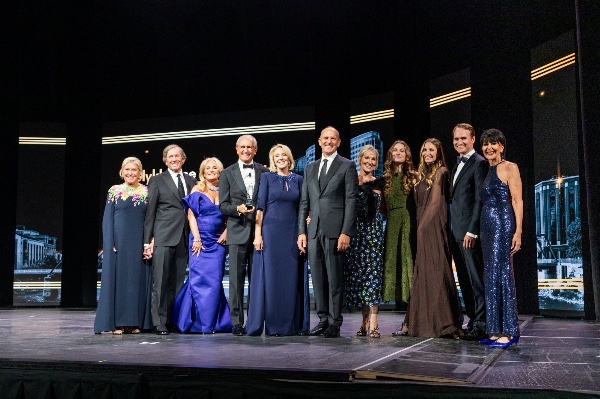President Mantella on stage with members of the DeVos family, which received the Slykhouse Community Leadership Award.