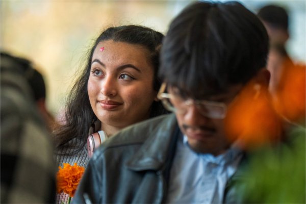 Ava Barajas listens to the lecture during GVSU's D&#237;a de los Muertos celebration.