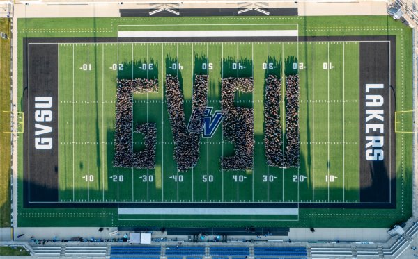 First-year GVSU students spell out GVSU on the football field. The end zone on the right has the word, "Lakers." The end zone on the left has the letters, "GVSU."