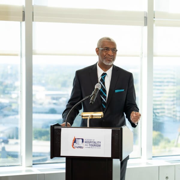 George Grant, dean of CCPS, speaks at a news conference Oct.16 in Grand Rapids about the Academy of Hospitality and Tourism Management.