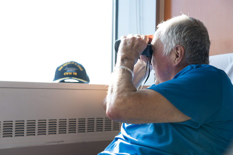 John Bowen looks out his hospital window at the Health Campus expansion.