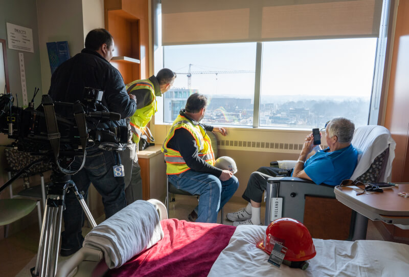 John Bowen looks out his hospital window at the Health Campus expansion.