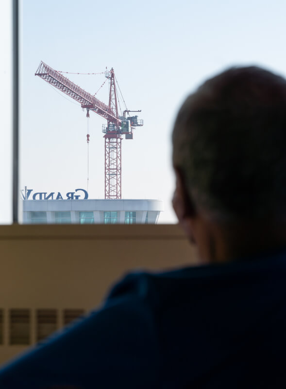 John Bowen looks out his hospital window at the Health Campus expansion.