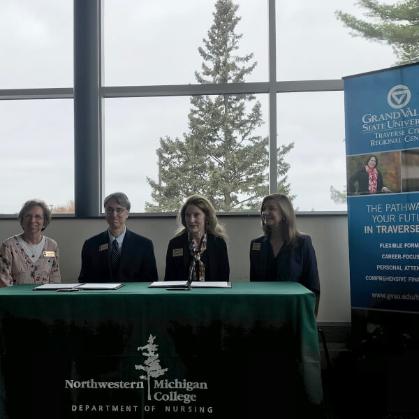 four people seated at a table