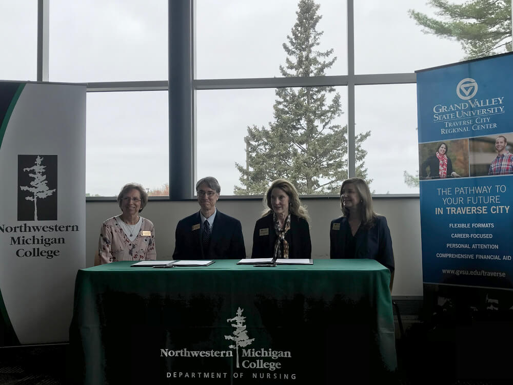 four people seated at a table