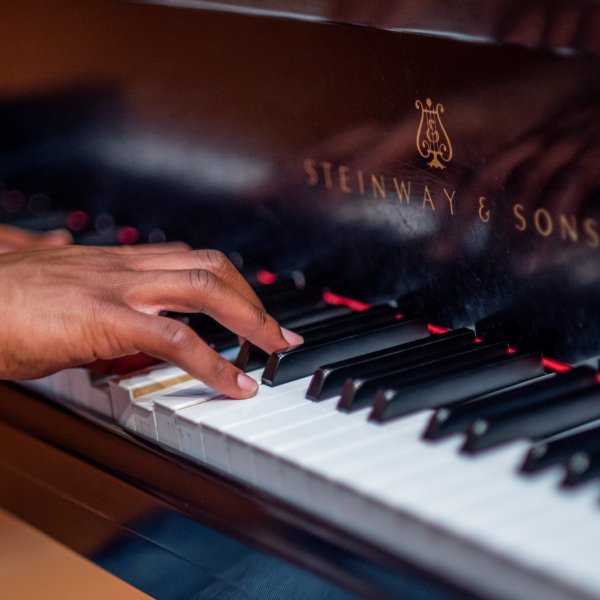 Someone playing a piano