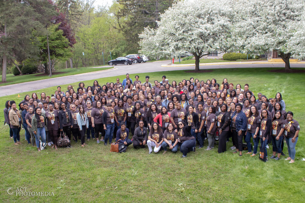 large group of women pictured outside