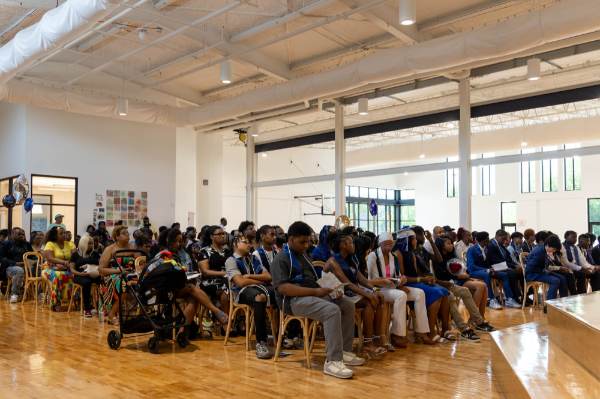 students and their supporters are seated for an eighth grade promotion ceremony at Detroit Achievement Academy